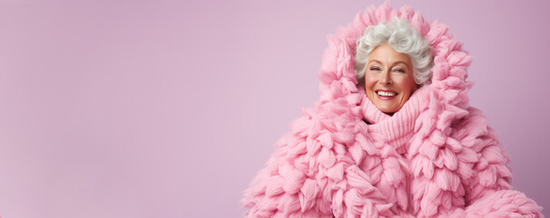 Fototapeta premium Old woman in full knitted cozy costume isolated on pastel background with a place for text 