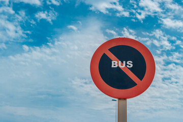 traffic sign for buses no stopping isolated on blue sky background