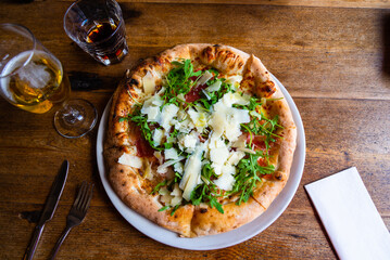 Eating Pizza at the pizzeria restaurant, on wooden table