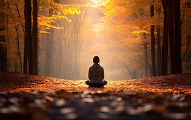  Young woman meditating in nature in autumn © AZ Studio