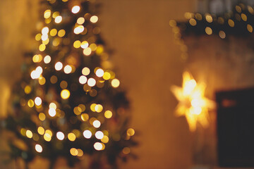 Christmas room golden bokeh. Blurred image of atmospheric christmas eve at fireplace. Defocused...