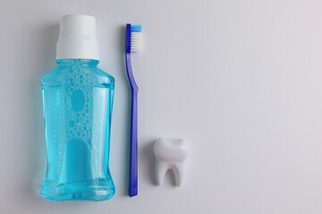 A mouthwash on a colored background. Dental care, dental health.