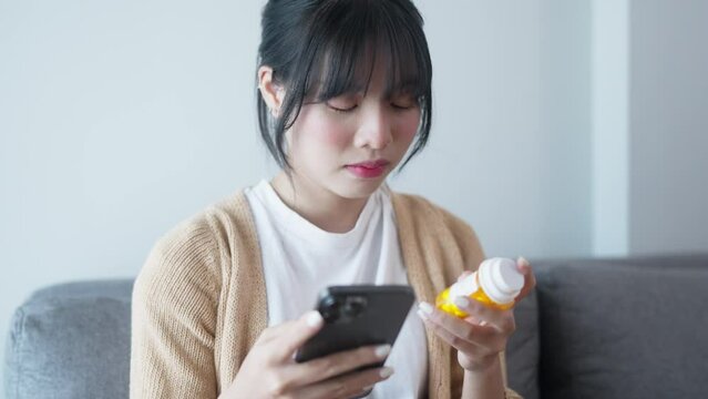 Hand Of Woman Using Smartphone For Searching Online Information About Prescription Pill Bottles.