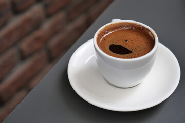 a cup of turkish coffee on table 