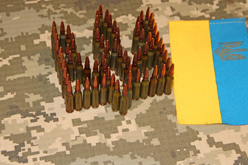Cartridges for Kalashnikov assault rifle. War Concept. Ukrainian national symbol