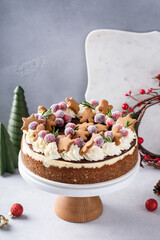 Festive Christmas cake idea, cheesecake decorated with gingerbread cookies and sugared cranberries