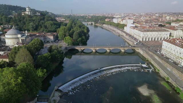 The drone aerial footage of Po River and Turin city at sunrise, Italy. The Po is the longest river in Italy.