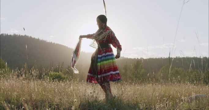 Beautiful Shot of Young Indigenous Woman Fancy Dancing In traditional Regalia