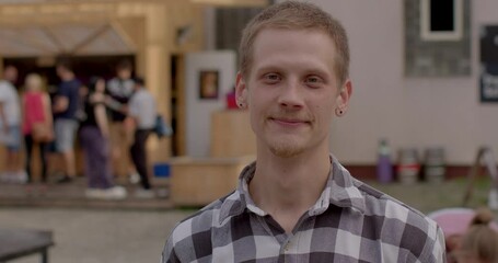 Portrait of smiling young man in urban life captures the essence of vibrant and dynamic city scene. Happy Teenager exuding positivity and enthusiasm Positive emotions radiating teenager face outdoor.