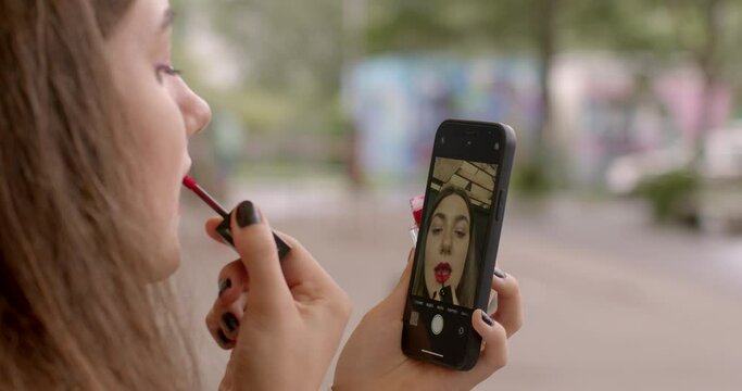 Girl doing makeup close. Body Dysmorphic Disorder. Individuals with BDD may engage in repetitive behaviors, grooming or mirror checking, in an attempt to alleviate distress related to their appearance