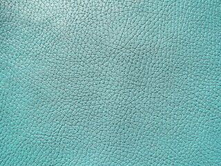 Genuine leather and genuine suede turquoise blue close-up as background