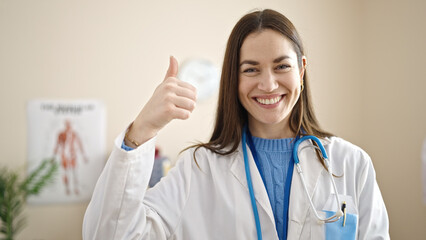Young caucasian woman doctor doing thumb up at clinic