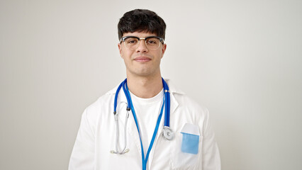 Young hispanic man doctor smiling confident standing over isolated white background