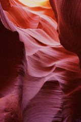 Flowing Striated Rock Formations with Warm Light in Antelope Canyon