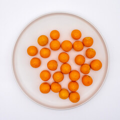 Close up photo of ripe golden goose berries on a white background