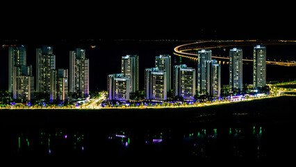 Incheon City South Korea Cityscape on a summer night with a view of the curving Incheon Bridge...