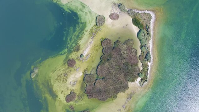 Top view aerial shot of an island on Sevan Lake on sunny summer day. Norashen Reserve, Gegharkunik Province, Armenia.