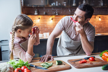 Father and daughter cooking