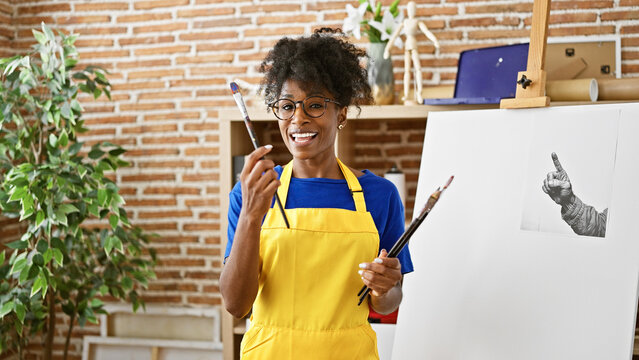 African american woman artist recording art video tutorial at art studio