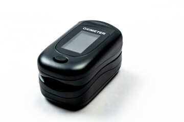 Digital pulse oximeter on white background.