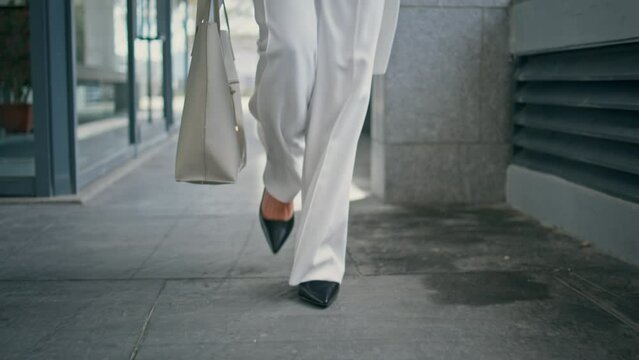 Stylish woman legs walking office in high heels closeup. Girl feet going on work