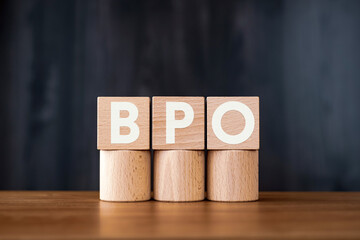 There is wood cube with the word BPO. It is an abbreviation for Business Process Outsourcing as eye-catching image.