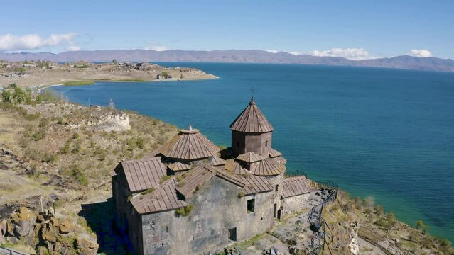Drone footage of Hayravank Monastery and Sevan Lake on sunny summer day. Gegharkunik Province, Armenia.