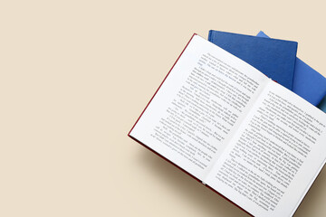 Open book on beige background