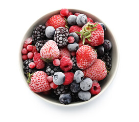 Bowl of frozen berries on white background