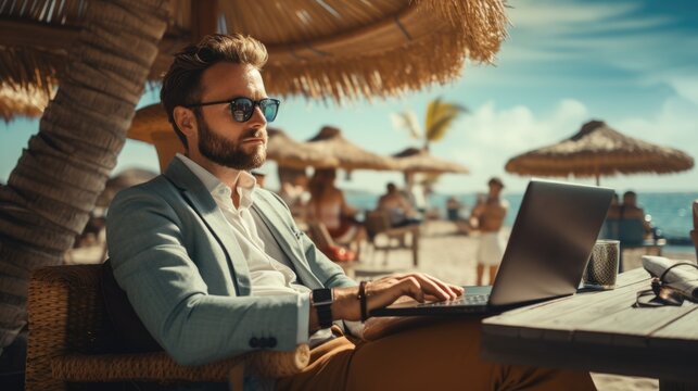 A man sitting at a table with a laptop. Bleisure or workation, person working remotely.