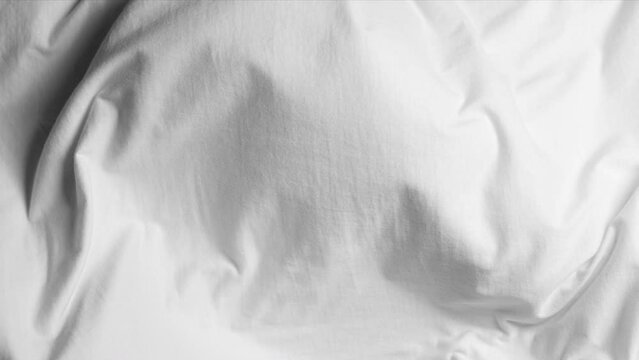 White fabric blowing in slow motion