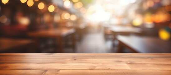 Empty wooden board on table in front of blurred background. Brown wood perspective for display of product.