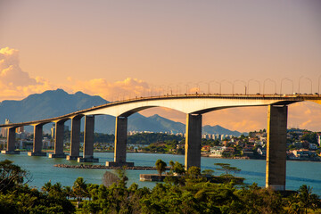 Sunset at Terceira Ponte (Third Bridge) located in Espírito Santo State, Brazil. Bridge that...