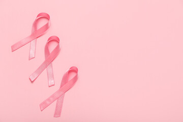 Pink ribbons on color background. Breast cancer awareness concept