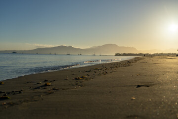 Idyllic tropical island beach scene at sunrise