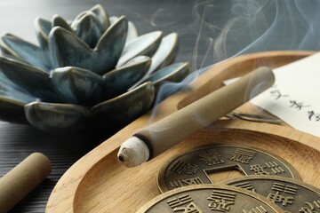 Acupuncture - alternative medicine. Moxa sticks and antique Chinese coins on table, closeup