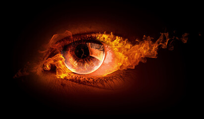 Macro image of human eye with fire flames