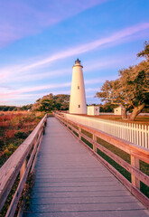 Ocracoke Lighthouse on Ocracoke Island , North Carolina at sunset.The lighthouse was built to help...