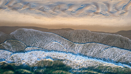 Aerial view of coastline and sand dunes of Ocracoke Island at sunrise, North Carolina, USA.