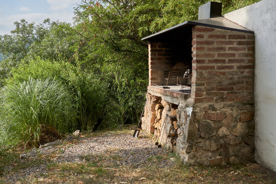 Taste of the Outdoors Rustic Stone Grill Amidst Lush Greenery