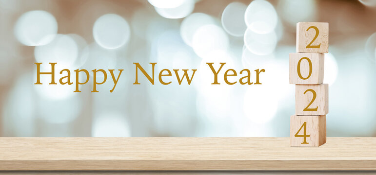 Happy New Year 2024 on wood cube block and blur abstract bokeh light background, Happy new year 2024 greeting card, banner
