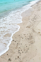 Wave of the sea on the sand beach