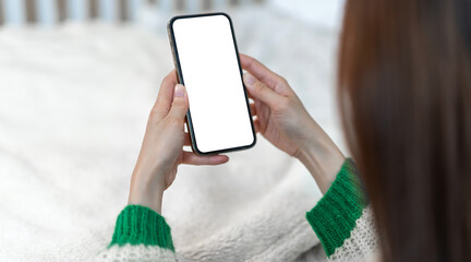 Human working on modern smartphone with blank white mobile screen for advertising, mockup, technology, advertising, search information, creative design, social media, online marketing, chat, phone