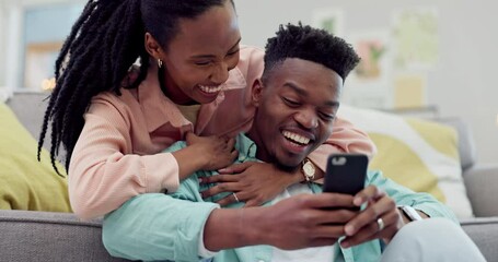 Love, smile or black couple with a smartphone, funny or connection with social media, laughing or relax. African people, man or woman in a lounge, cellphone or home with digital app, meme or marriage