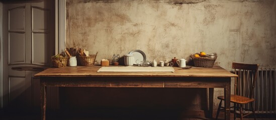 Desk and table in an empty, shabby, old kitchen.