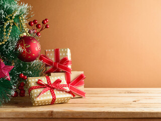 Wooden table with Christmas tree and gift boxes. Background for mock up design and product display - 646648992