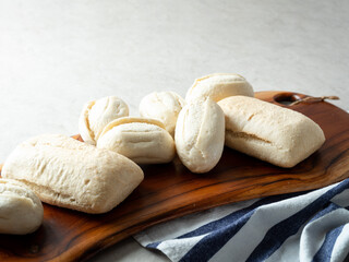 frozen dough bread on wooden plate