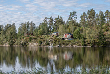 Lake Ragnerudssjoen in Dalsland Sweden beautiful nature forest pinetree swedish houses