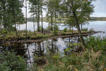 Lake Ragnerudssjoen in Dalsland Sweden beautiful nature forest pinetree swedish houses