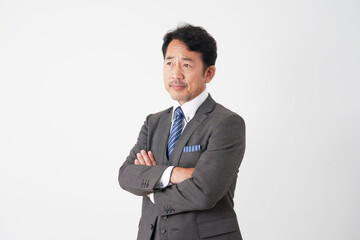 中年のビジネスマンのポートレート　白背景